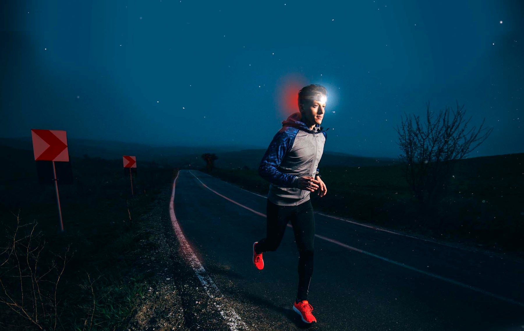 Man running with the NiteRider Road Runner 320 headlamp.  This light is the best camping, running, trail, overlanding, overland headlamp.  At 320 lumens it fits in the best range of lumens for a useful night light.